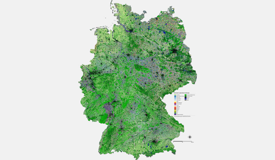 Deutschlandkarte mit einem Flickenteppich bunt dargestellter landwirtschaftlichen Flächen.